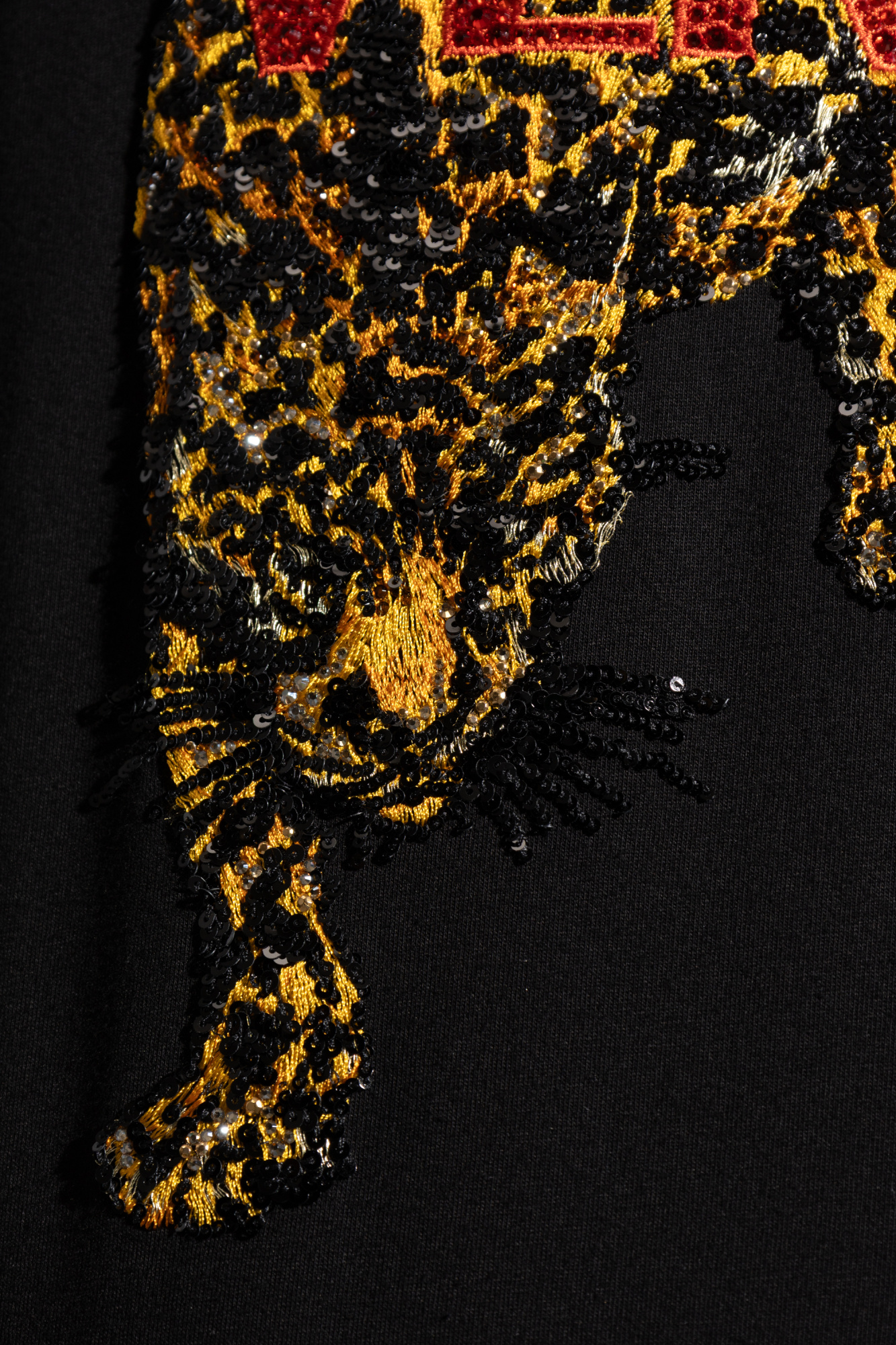 Black T-shirt with shimmering appliqués Versace - Vitkac AS